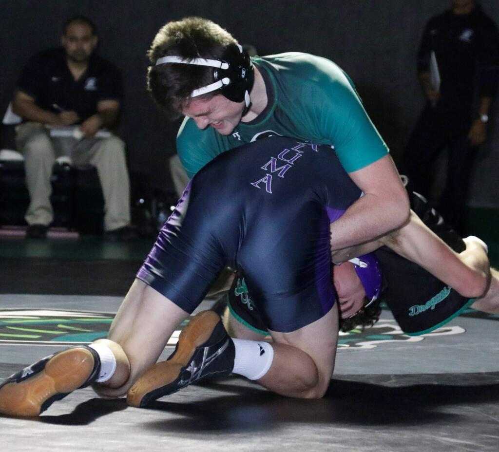 Sophomore Robert Greenslade in a match gets a grip on his Petaluma opponent. (Bill Hoban / Special to the Indexz-Tribune)