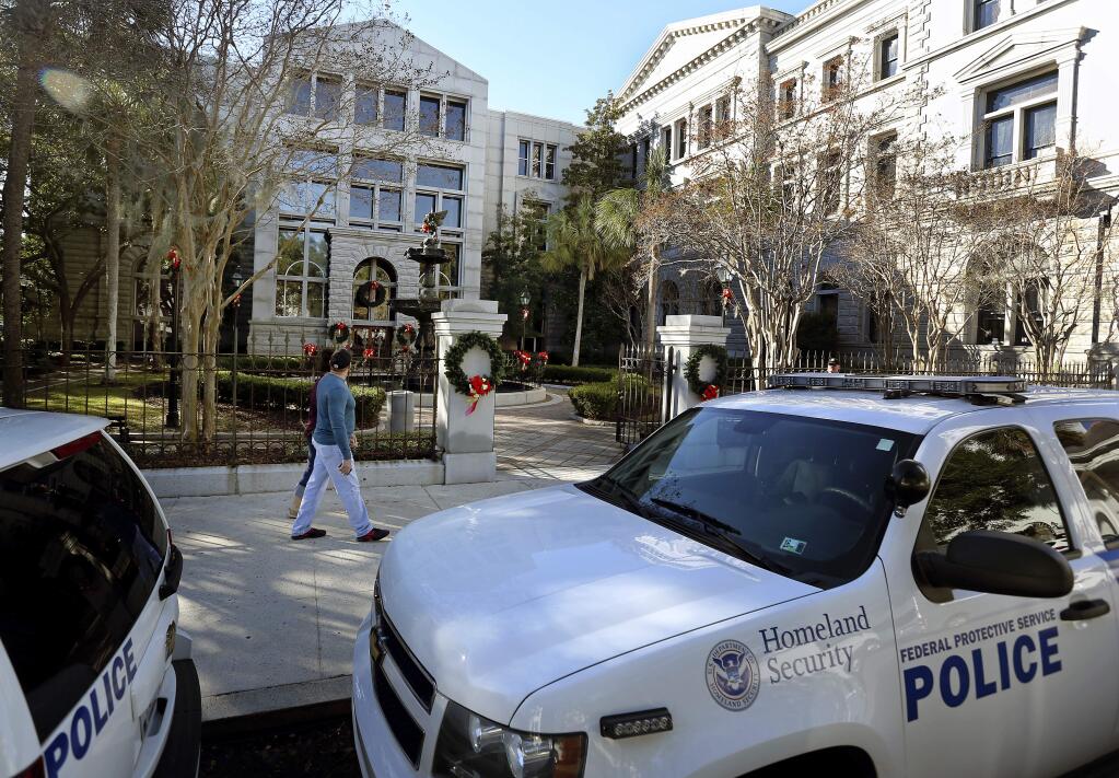 Homeland Security patrol the streets outside the Federal Courthouse Wednesday, Dec. 7, 2016, in Charleston,S.C., during Dylann Roof's trial. Roof, a white man, is accused of killing nine black people at a church. (Grace Beahm/The Post And Courier via AP)