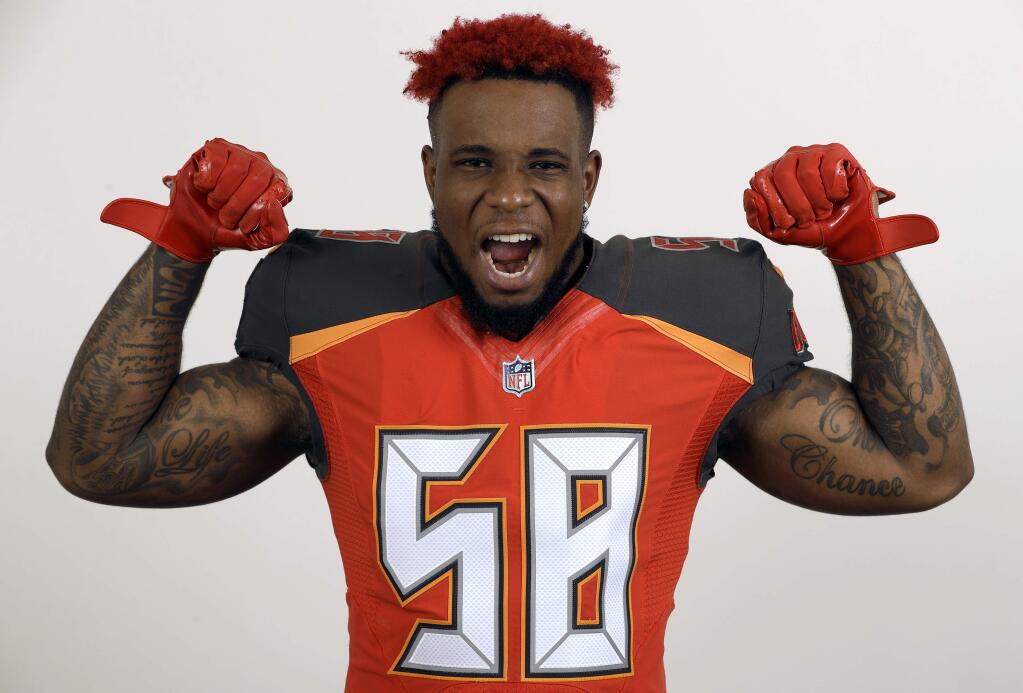 FILE - This is a June 6, 2018, file photo showing Tampa Bay Buccaneers outside linebacker Kwon Alexander during a studio photo session at the team training facility, in Tampa, Fla. The San Francisco 49ers have agreed to sign linebacker Kwon Alexander to a four-year contract worth $54 million. A person familiar with the contract said the sides came to an agreement Monday, March 11, 2019, soon after teams were allowed to contact pending unrestricted free agents. The person spoke on condition of anonymity because the deal can't be finalized until the new league year starts Wednesday. (AP Photo/Chris O'Meara, File)