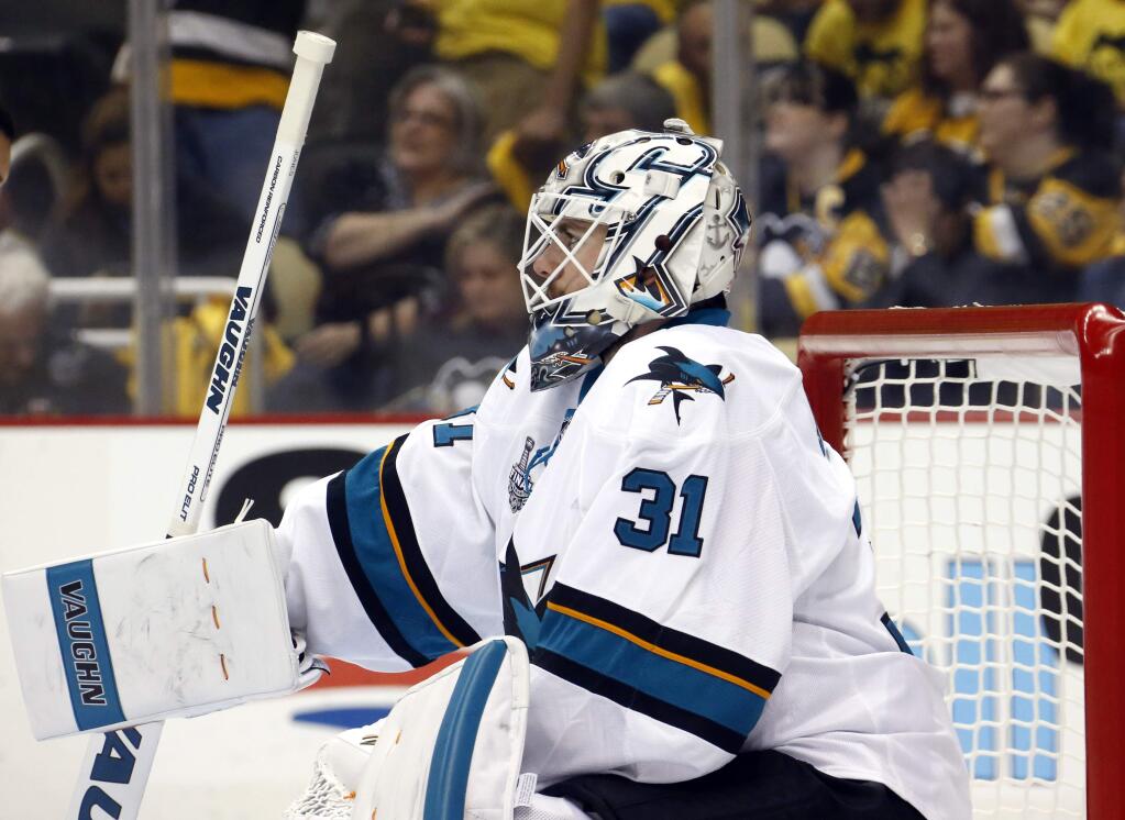 San Jose Sharks goalie Martin Jones pauses during the first period in Game 5 of the Stanley Cup Finals against the Pittsburgh Penguins on Thursday, June 9, 2016, in Pittsburgh. (AP Photo/Keith Srakocic)