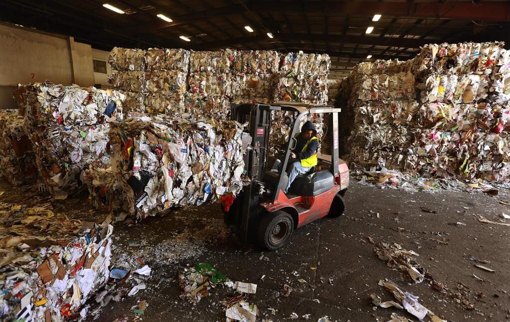 The Redwood Empire Disposal Santa Rosa plant has a 5,000 ton backlog of recycled paper, plastic and metal waiting to be shipped because of a slowdown at the Port of Oakland. (Photo by John Burgess/The Press Democrat)