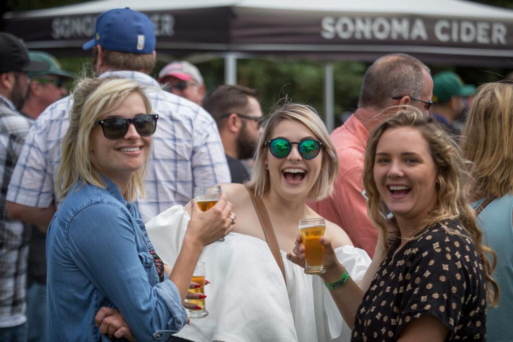Frankie Kellogg, left, Allie Foulk, and Jamin Self attend Beer Fest The Good One in Santa Rosa on Saturday, June 10, 2017. (JEREMY PORTJE/FOR THE PD)