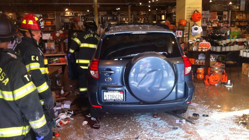 A driver in an SUV crashed through the front of a Sur La Table store in Montgomery Village, Thursday, Oct. 8, 2015. (KENT PORTER / PRESS DEMOCRAT)