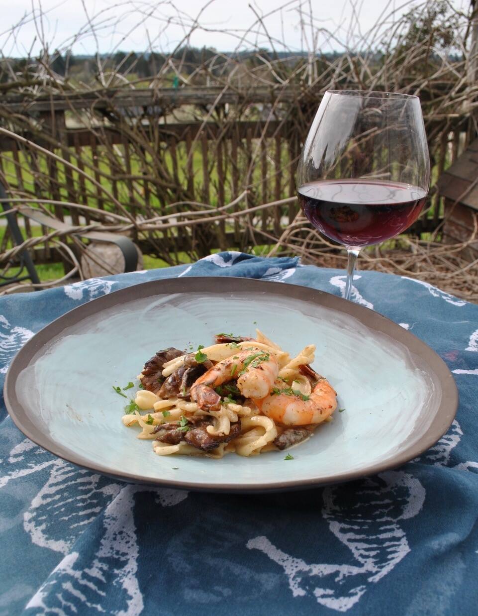 Black Chanterelles & Shrimp in Brown Butter with Pasta & Crème Fraiche makes a perfect pairing with our wine of the week, a pinot noir from Paul Mathew. (Gina Jordan)