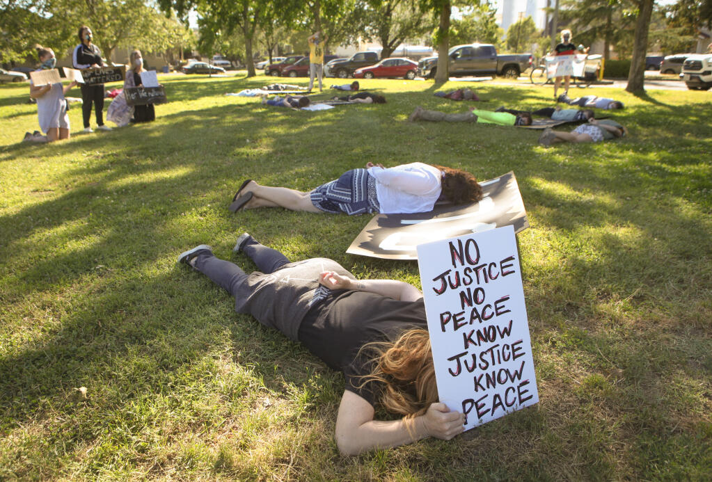 On June 16, a crowd gathered on the lawn outside of Petaluma’s City Hall to protest a recent vote to spend nearly $80,000 on semi-automatic rifles for the police. (CRISSY PASCUAL/ARGUS-COURIER STAFF)