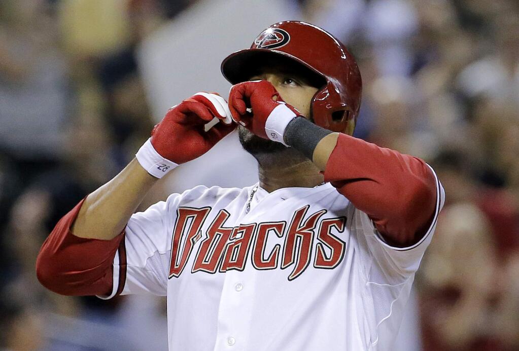 FILE - In this Thursday, July 31, 2014, file photo, Arizona Diamondbacks' Andy Marte celebrates his two run home run against the Pittsburgh Pirates during the sixth inning of a baseball game in Phoenix. Authorities in the Dominican Republic said, Sunday, Jan. 22, 2017, that Kansas City Royals pitcher Yordano Ventura and former major leaguer Marte both have died in separate traffic accidents. (AP Photo/Matt York, File)