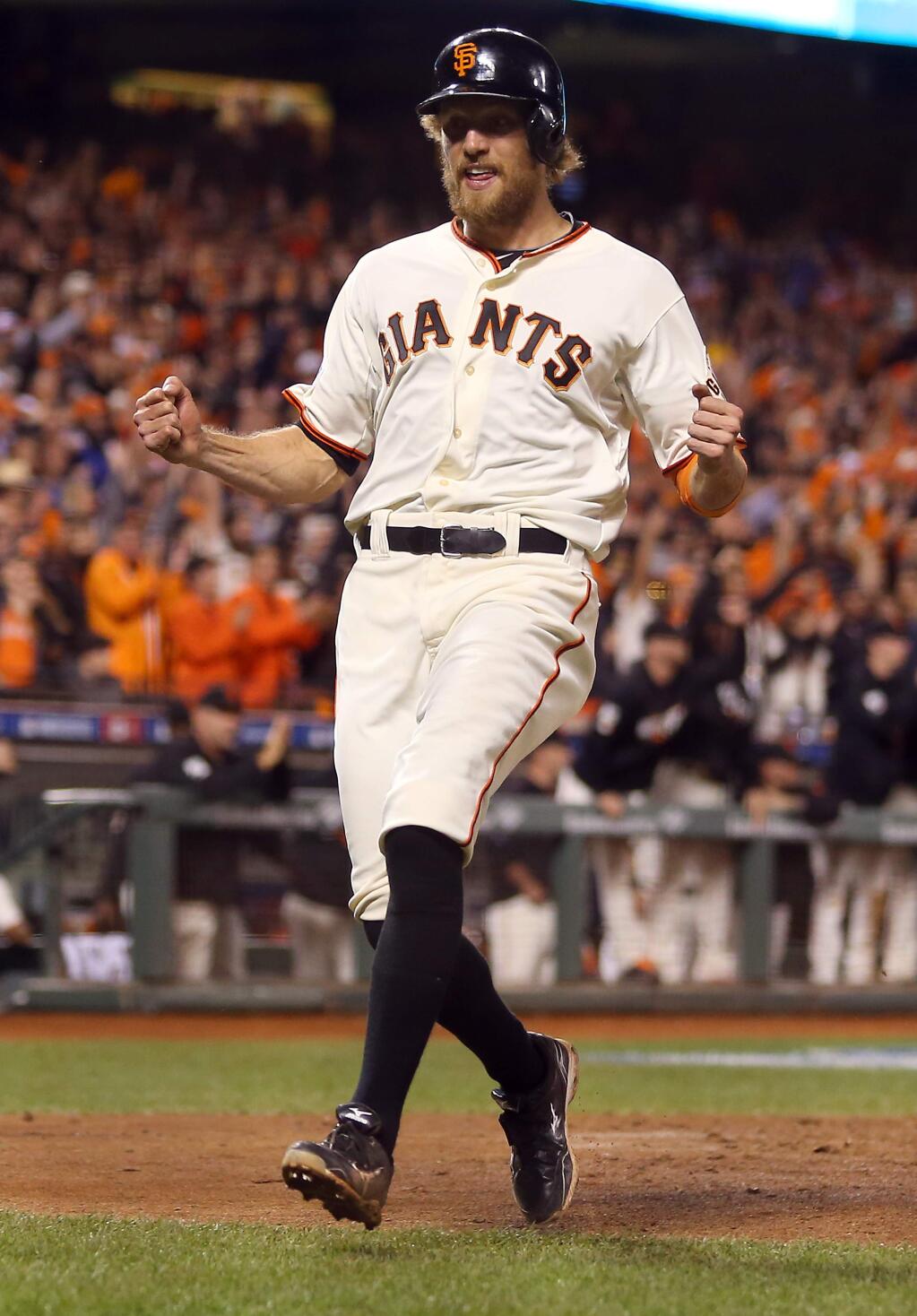 San Francisco Giants' Hunter Pence scores in the fifth inning on a sacrifice fly by Juan Perez in the fifth inning of Game 4 of the World Series San Francisco on Saturday, October 25, 2014. The Giants defeated the Royals 11-4.(Christopher Chung/ The Press Democrat)