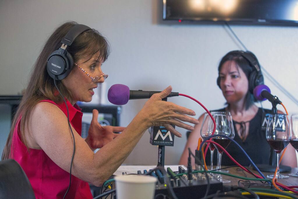 Left, Marcia Macomber, of Cornucopia Creations, with Ruby Fontanta, right, leads a podcast about three Canihan wines from a back room at The Panel on West Napa St. on Thursday, July 25. (Photo by Robbi Pengelly/Index-Tribune)