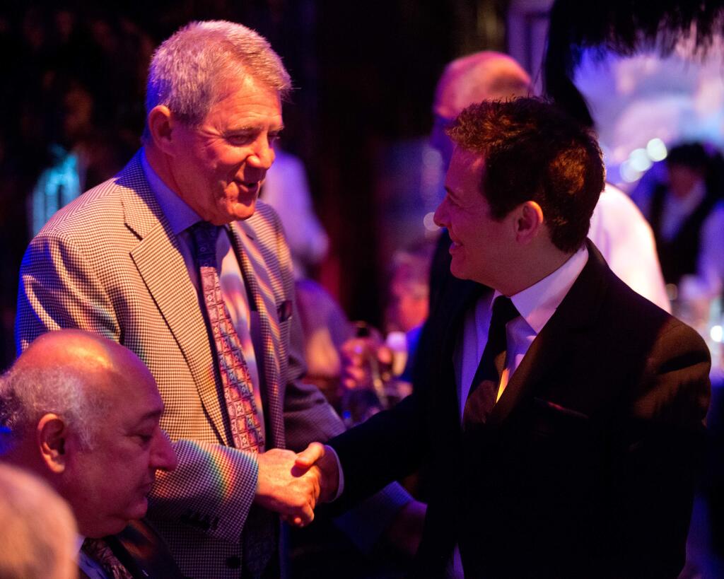 Henry Hansel, left, greets Michael Feinstein during the Green Music Center's 2014-2015 Season Opening Gala in Rohnert Park, California, on September 28, 2014. (Alvin Jornada / For The Press Democrat)