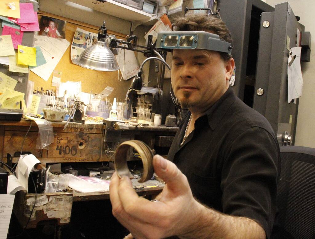 Dan Trudeau, above in his Halem & Co. workspace, is cutting out his own niche in fire recovery -- jewelry repair.