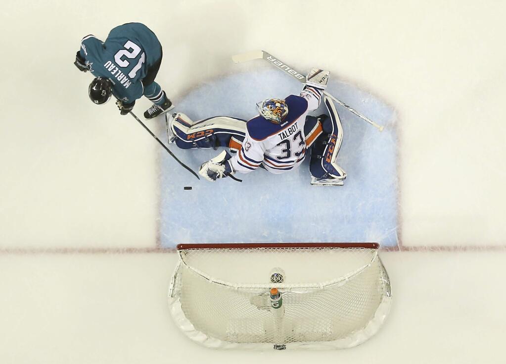 Edmonton Oilers goalie Cam Talbot blocks a goal attempt by San Jose Sharks center Patrick Marleau during the second period in Game 6 of their first-round playoff series Saturday, April 22, 2017, in San Jose. (AP Photo/Tony Avelar)