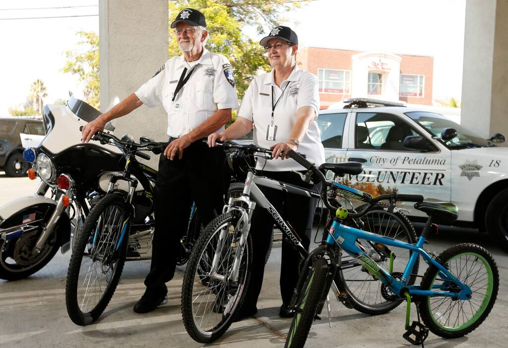 Petaluma Police Volunteers Jim and Merle Inden have been rebuilding bicycles that the Petaluma Police Department salvages from the streets, then donate the finished bikes to local nonprofit organizations, at the Petaluma Police Department in Petaluma, California on Wednesday, August 23, 2017. (Alvin Jornada / The Press Democrat)