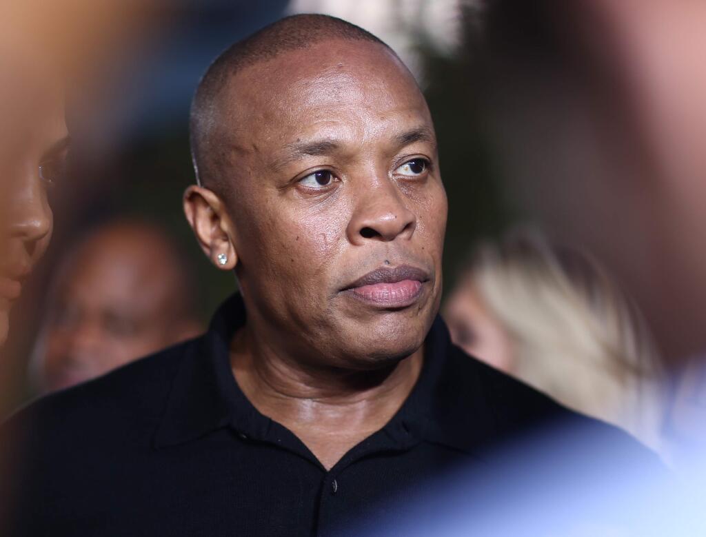FILE - In this Aug. 10, 2015, file photo, Dr. Dre arrives at the Los Angeles premiere of 'Straight Outta Compton.' Dr. Dre has been cited after the Los Angeles County Sheriff's Department says a man told them Dre pointed a handgun at him outside of his Malibu, California, home. (Photo by John Salangsang/Invision/AP, File)
