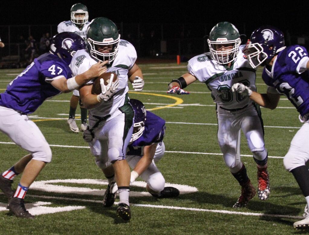 Bill Hoban/Index-TribuneDragons host Analy tonightSonoma's Tyler Winslow looks for some running room while Ryan Sherwood throws a block during last Saturday's game against Petaluma. The Dragons will host Analy at 7:30 p.m. tonight, Friday, Oct. 6, at Arnold Field.