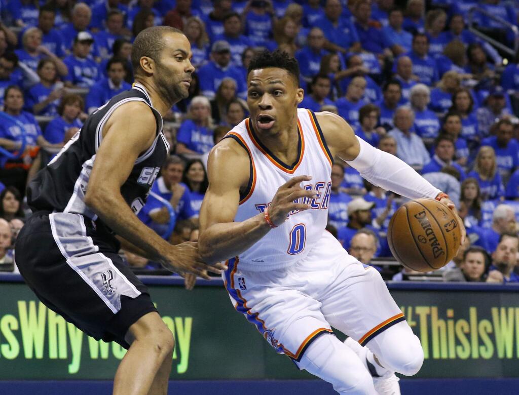 Oklahoma City Thunder guard Russell Westbrook (0) drives around San Antonio Spurs guard Tony Parker, left, in the first quarter of Game 6 of a second-round playoff series in Oklahoma City, Thursday, May 12, 2016. (AP Photo/Alonzo Adams)