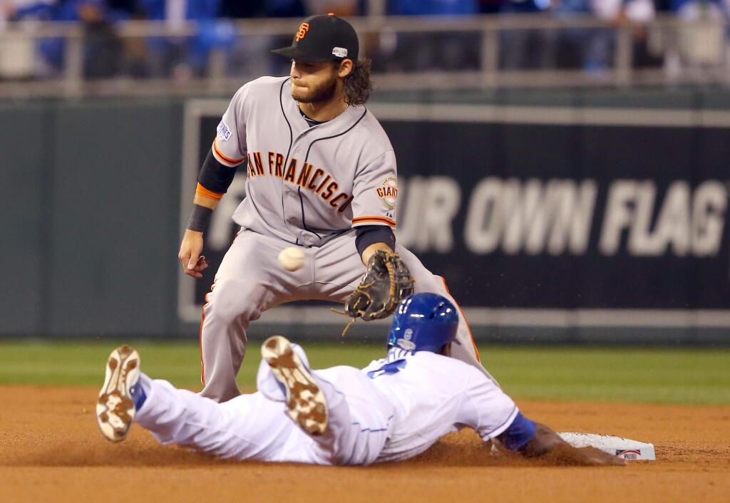 Giants shortstop Brandon Crawford tags out the Royals' Lorenzo Cain in the first inning during Game 7 of the World Series in Kansas City, Wednesday Oct. 29, 2014 (Christopher Chung / Press Democrat)