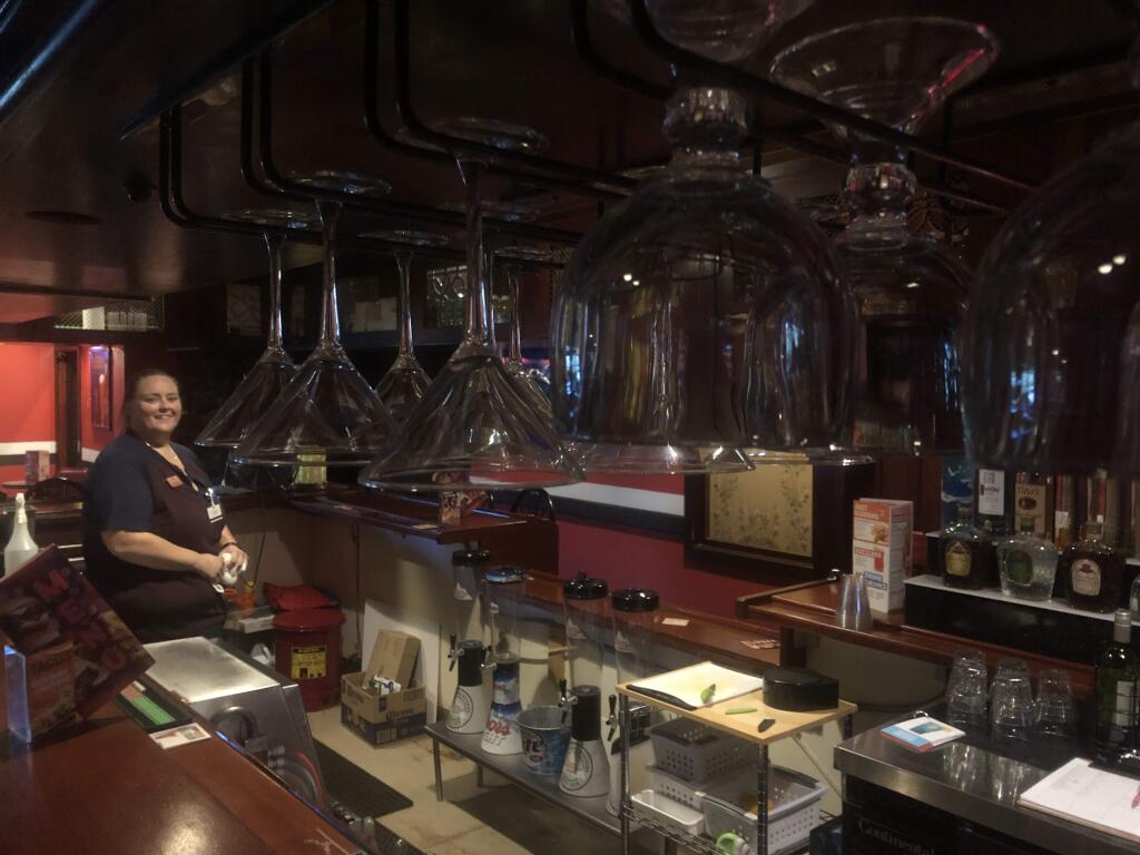 Sarah Pettinger, manager of AMF Boulevard Lanes, in the bar (martini glasses hanging in the foreground)