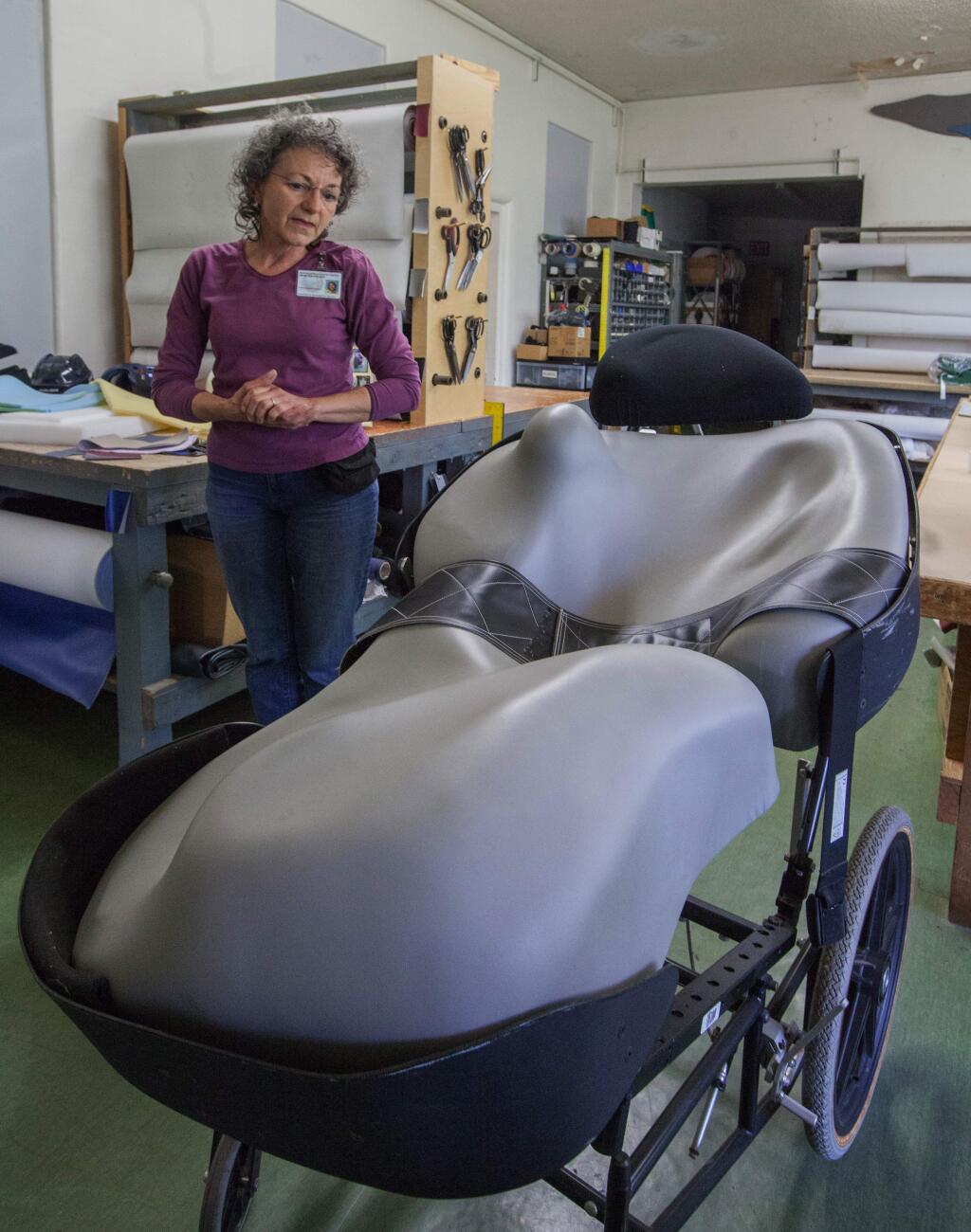 Robbi Pengelly/Index-TribuneIrene Batchelder of SDC demonstrates a custom-built wheelchair, built at the medical services department to individual measurements.