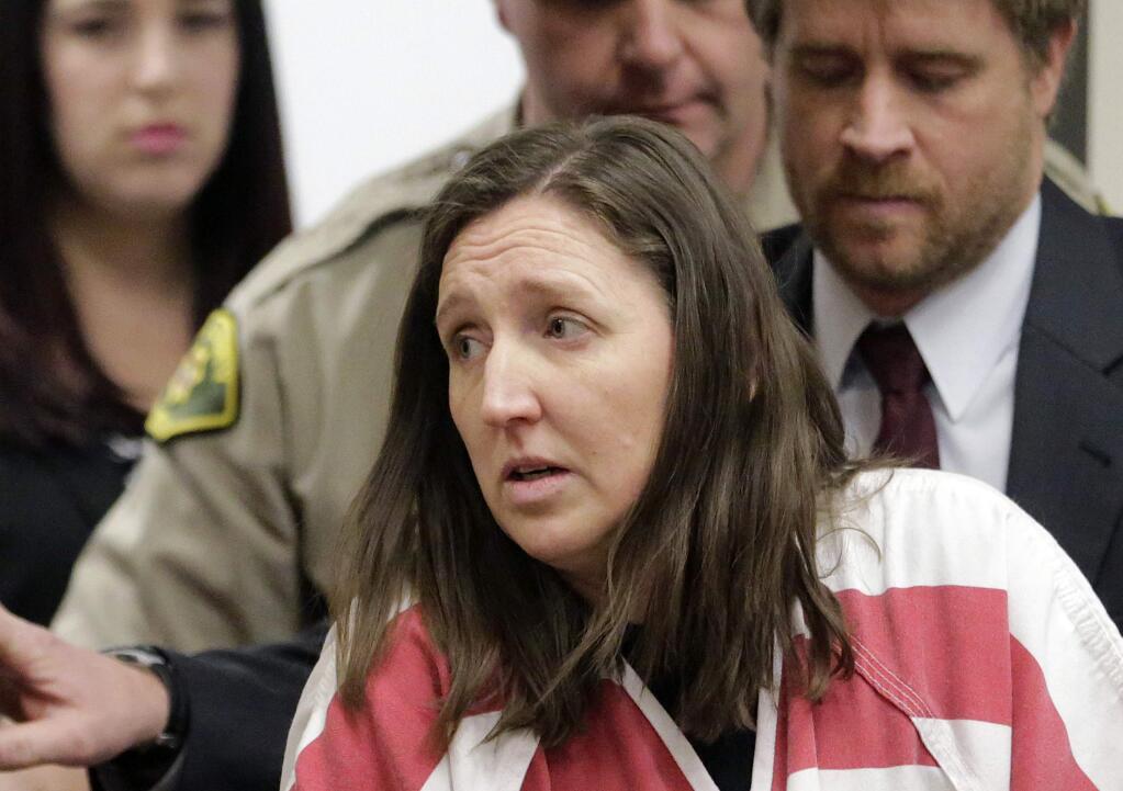 FILE - This Feb. 12, 2015 file photo, Megan Huntsman arrives in court in Provo, Utah. Huntsman who pleaded guilty to killing six of her newborn babies and storing their bodies in her garage is set to be sentenced. She faces up to life in prison at a hearing Monday, April 20, 2015 in Provo. (AP Photo/Rick Bowmer, Pool,File)
