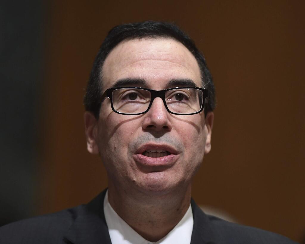In this Feb. 14, 2018 photo, Treasury Secretary Steven Mnuchin testifies before the Senate Finance Committee on Capitol Hill in Washington. The Trump administration accused Russia on Thursday of a concerted, ongoing operation to hack and spy on the U.S. energy grid and other critical infrastructure. (AP Photo/Susan Walsh)