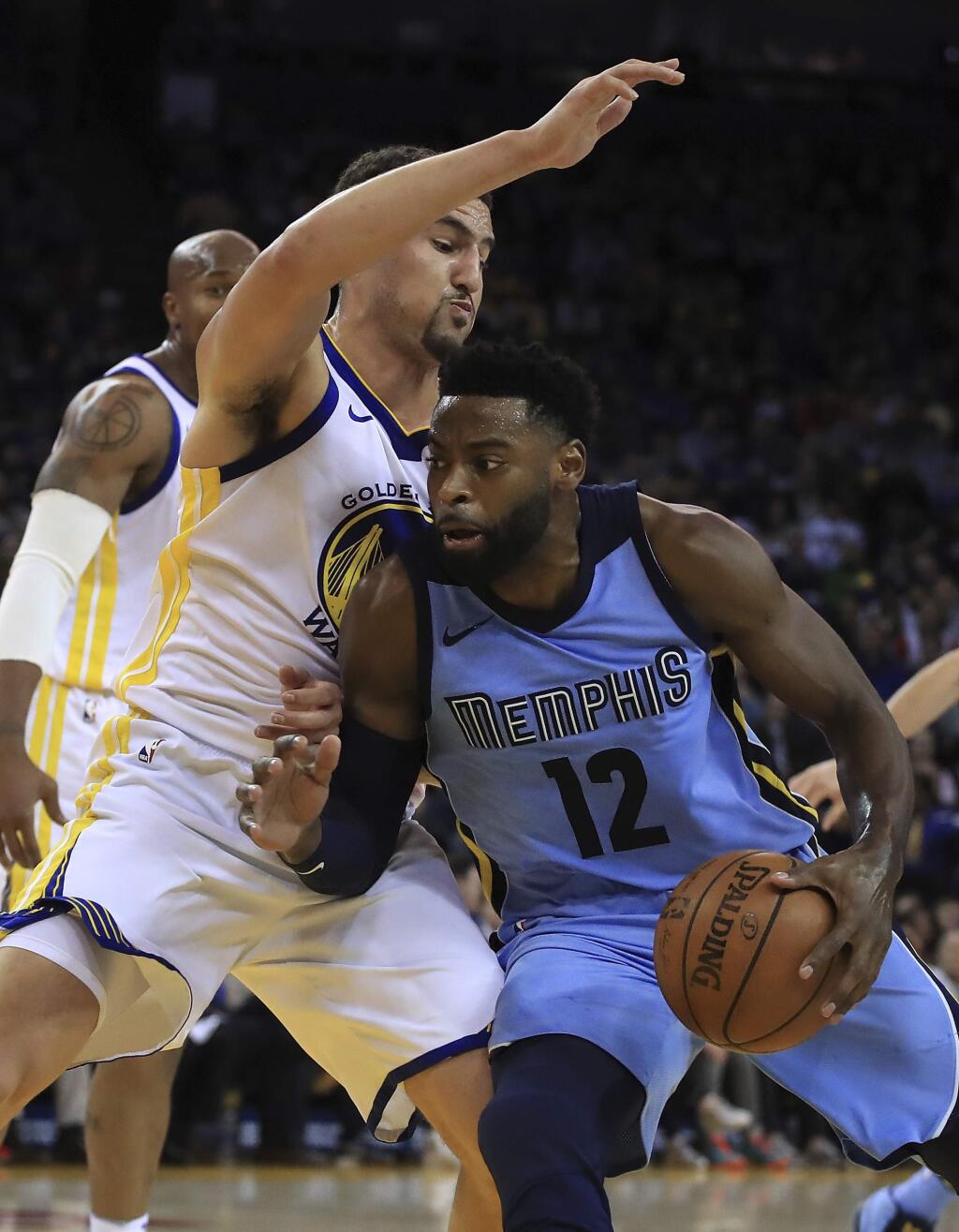 Memphis Grizzlies' Tyreke Evans (12) drives the ball against Golden State Warriors' Klay Thompson during the first half of an NBA basketball game Wednesday, Dec. 20, 2017, in Oakland, Calif. (AP Photo/Ben Margot)