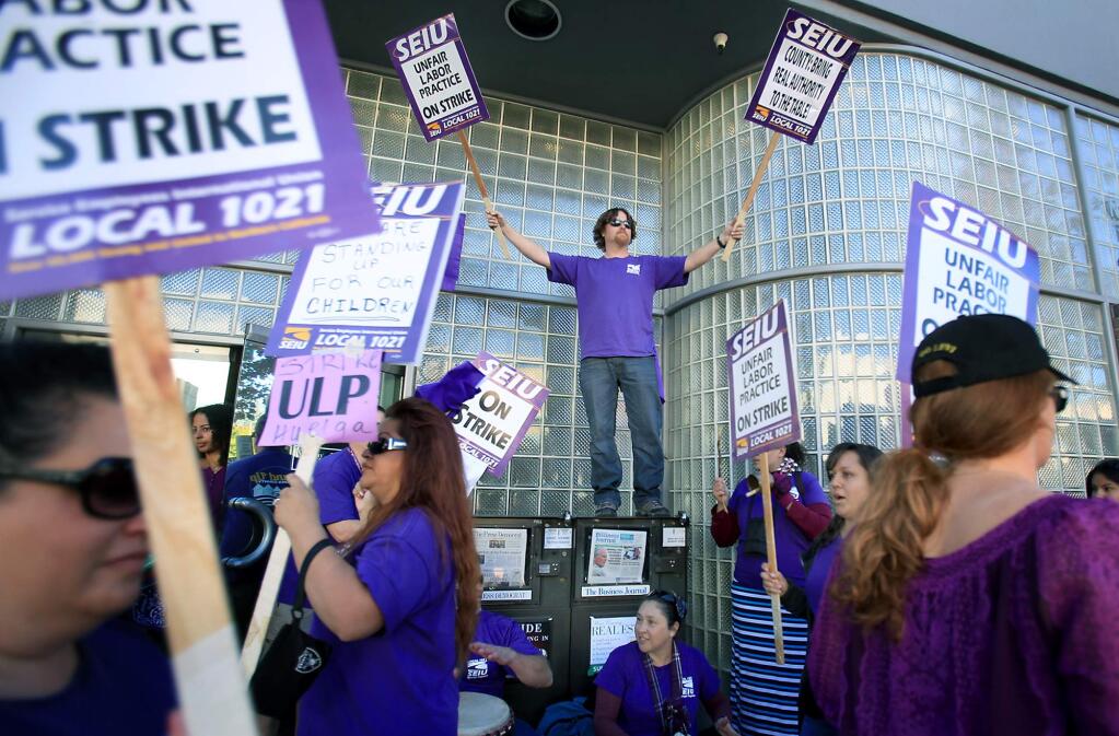 Service Employees International Union Local 1021, protest in downtown Santa Rosa on Thursday, Nov. 19, 2015. (KENT PORTER/ PD FILE)