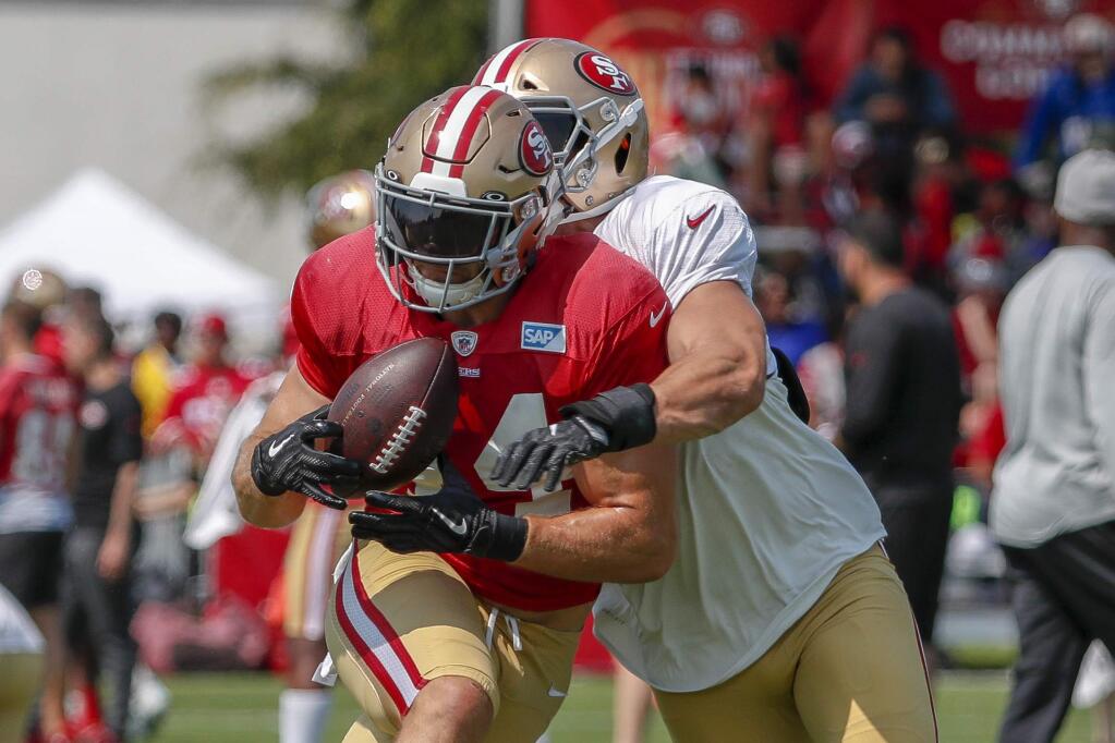 San Francisco 49ers running back Kyle Juszczyk catches a pass during practice at the team's headquarters Saturday, July 28, 2018, in Santa Clara. (AP Photo/Tony Avelar)