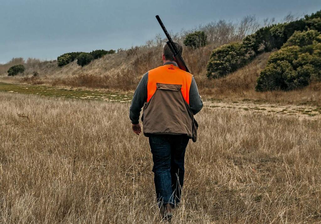 A hunter trudges through the Wing and Barrel Ranch property on Noble Road off Highway 37.