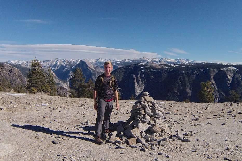 Petaluma 16-year-old Tucker Cullen stands on the rim of Yosemite Valley. He is about to embark on a 220-mile hike of the John Muir Trail to raise money for outdoor education programs. COURTESY TUCKER CULLEN