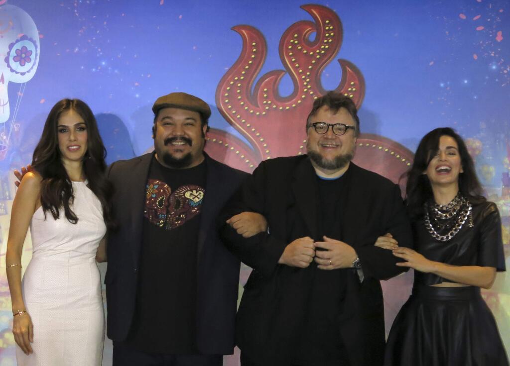 Mexican actress Sandra Echeverria, from left, Mexican director Jorge Gutierrez, Mexican producer Guillermo del Toro and Mexican actress Ana de la Reguera, pose for a portrait during a press conference promoting their animated film, El libro de la vida, or 'The Book of Life, in Mexico City, Tuesday, Oct. 7, 2014. The film is about the Mexican holiday Day of the Dead. (AP Photo/Berenice Bautista)