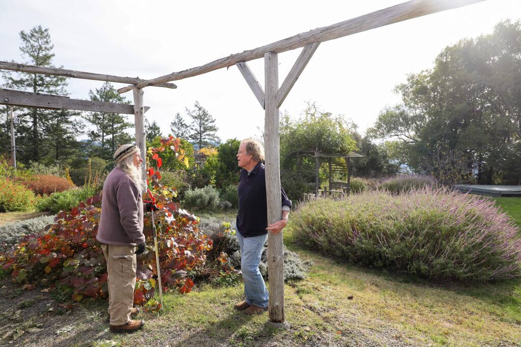 Karen Vogel, left, talks with Pieter Myers at the Ocean Song property, off of Coleman Valley Road, in west Sonoma County, on Tuesday, December 17, 2019. (Christopher Chung/ The Press Democrat)