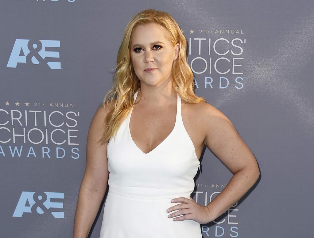 FILE -In this Jan. 17, 2016 file photo, Amy Schumer arrives at the 21st annual Critics' Choice Awards in Santa Monica, Calif. Schumer says in an essay published Friday, Oct. 28, that her “Formation” video, which shows her singing and dancing to the Beyoncé song alongside Goldie Hawn, Wanda Sykes and Joan Cusack, is not a parody, but a tribute approved by Beyoncé and Jay Z. (Photo by Jordan Strauss/Invision/AP, File)