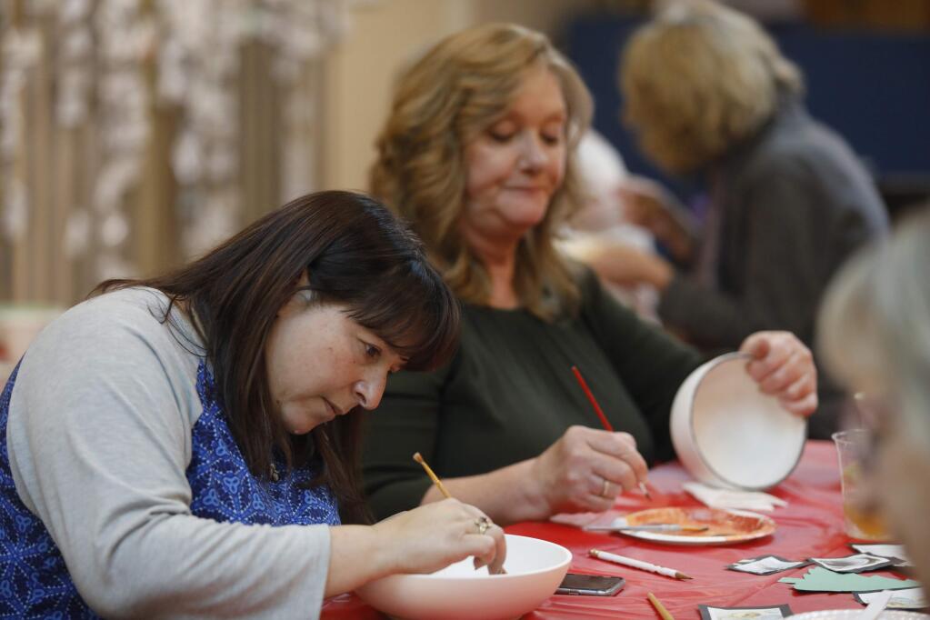 Cindy Skanderson, left, and Jeanette Genovese paint bowls for the 1,000 Petaluma Bowls fundraising event for the Petaluma People Services Center. Photos taken at Elim Lutheran Church in Petaluma on Sunday, November 11, 2018. (BETH SCHLANKER/ The Press Democrat)
