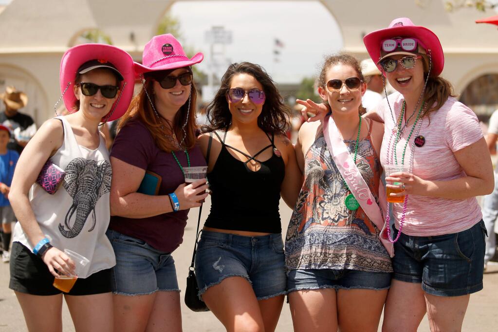 Bride-to-be Ali Calder, second from right, and members of her bridal party, from left, Molly Toleikis, Ali Brilliant, Ashley Lewis and Elide Sutherland celebrate Ali's bachelorette party during the second day of the Country Summer Music Festival at Sonoma County Fairgrounds in 2018. (Alvin Jornada The Press Democrat file)