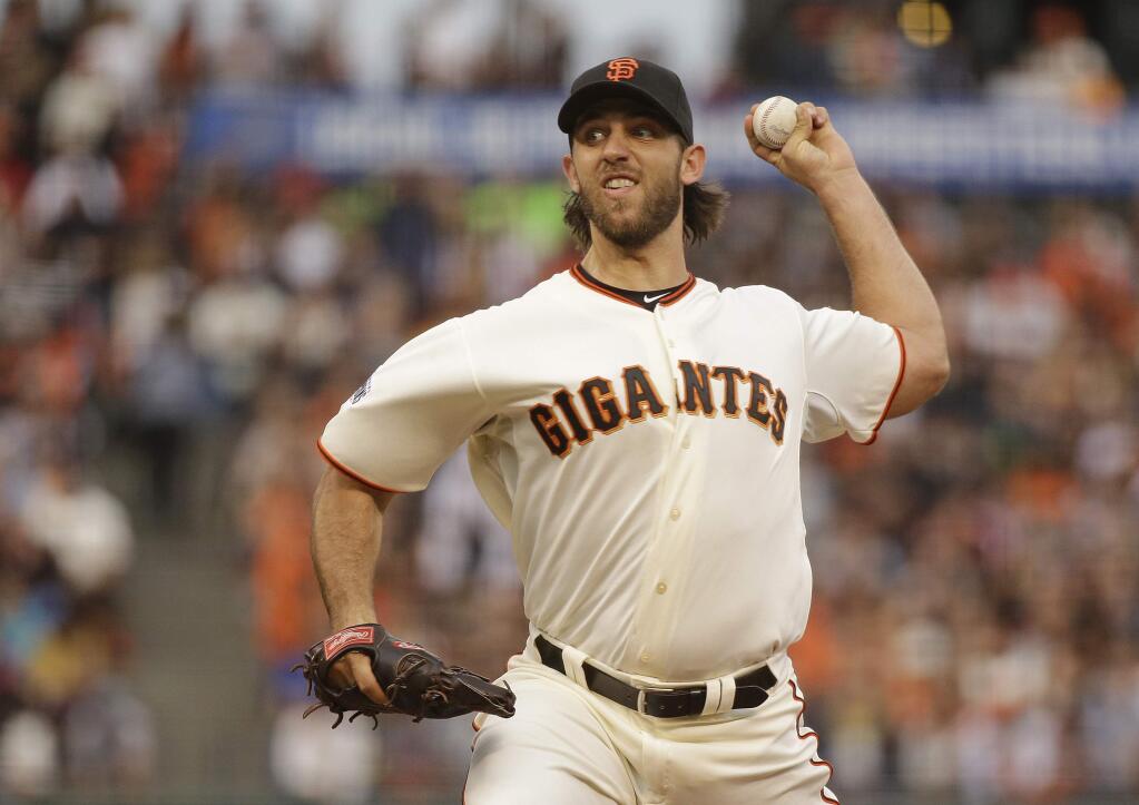 San Francisco Giants starting pitcher Madison Bumgarner throws against the San Diego Padres during the second inning of a baseball game Saturday, Sept. 12, 2015, in San Francisco. (AP Photo/Eric Risberg)