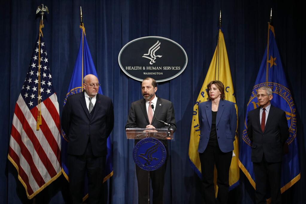 Health and Human Services Secretary Alex Azar speaks at a news conference, Tuesday, Jan. 28, 2020, in Washington, about the federal government's response to a virus outbreak originating in China that has has sickened thousands of people and killed more than 100. Standing with Azar are, from left, Centers for Disease Control and Prevention Director Robert Redfield, National Center for Immunization and Respiratory Disease Director Nancy Messonnier and National Institute of Allergy and Infectious Diseases Director Anthony Fauci. (AP Photo/Patrick Semansky)