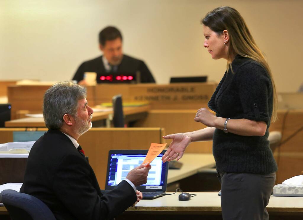 (FILE PHOTO) Public defender Mike Perry talks with Jasmine Roper after her weekly appearance before Judge Kenneth Gnoss in the Sonoma County Drug Court on March 14, 2015. (Photo by John Burgess/The Press Democrat)