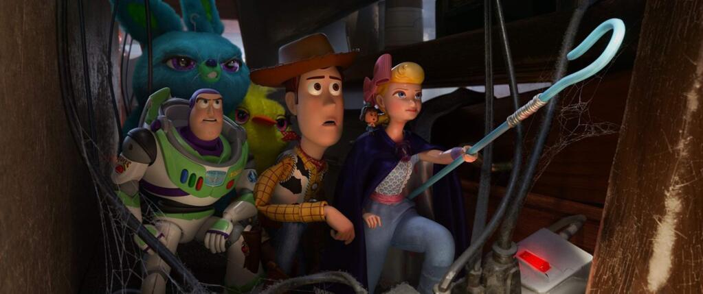 Tim Allen as Buzz Lightyear, Tom Hanks as Woody and Annie Potts as Bo Peep in a scene from 'Toy Story 4.' (Disney/Pixar)