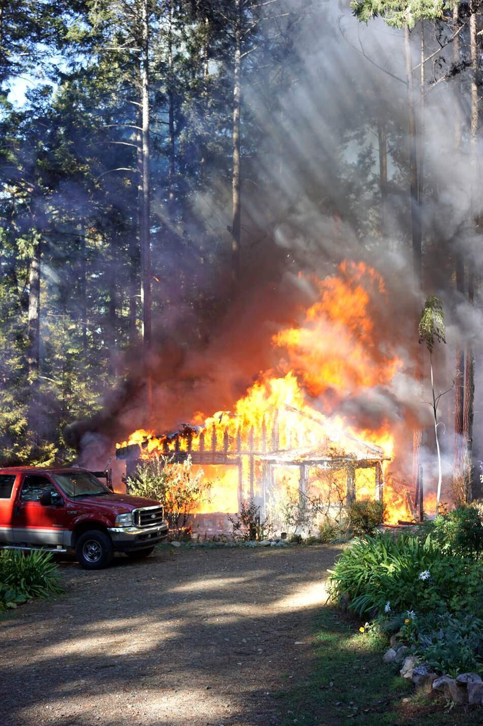 This photo of the home in flames was taken by Philip Barlow.
