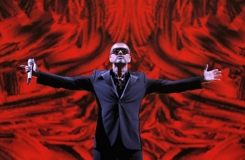 FILE - In this Sept. 9, 2012 file photo, British singer George Michael performs at a concert to raise money for the AIDS charity Sidaction, during the Symphonica tour at Palais Garnier Opera house in Paris, France. Michael, who rocketed to stardom with WHAM! and went on to enjoy a long and celebrated solo career lined with controversies, has died, his publicist said Sunday, Dec. 25, 2016. He was 53. (AP Photo/Francois Mori, File)