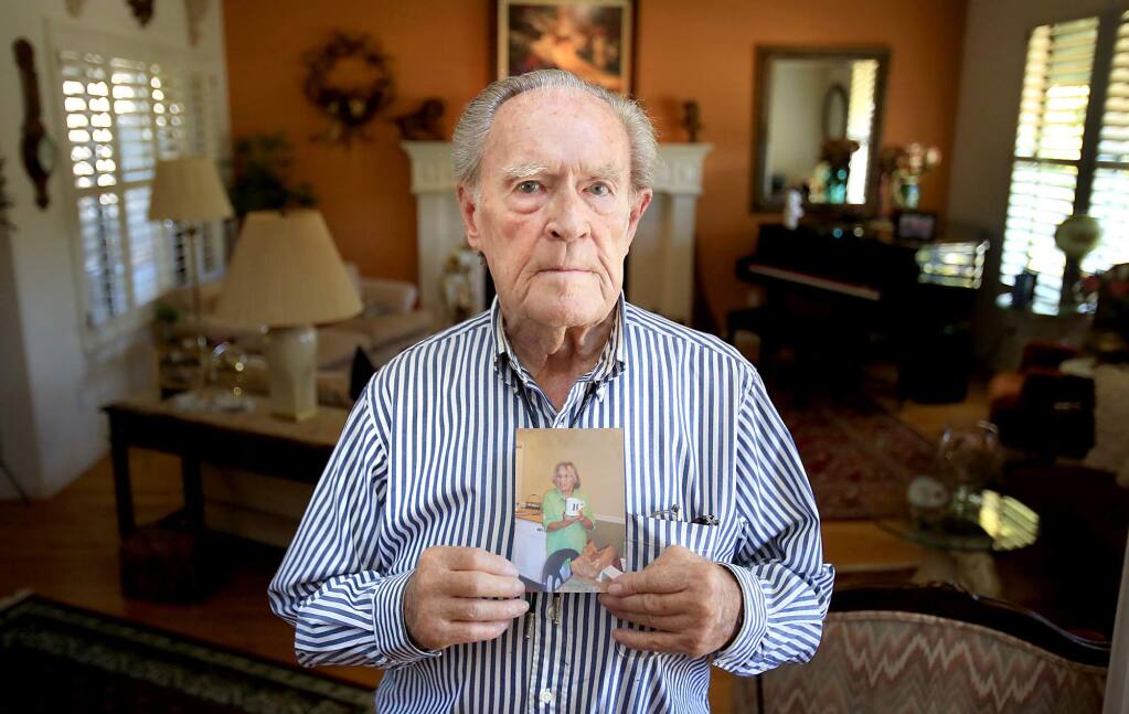 Oakmont resident Denny Ragan, 86, Monday July 27, 2015 with a picture of his wife Barbara who jumped off a Kaiser Permanente parking structure and died. The Ragan family says that Kaiser failed to give her timely and adequate care and was having trouble with her medication. (Kent Porter / Press Democrat) 2015