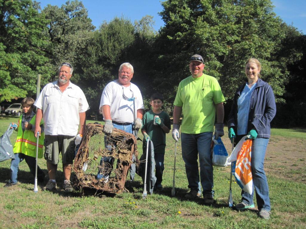Green Valley Consulting Engineers principal and owner Liz Ellis (right) at the Creek Day cleanup event with staff members (from left) Charlie Williamson, Vern Tyree and Sean Lawson