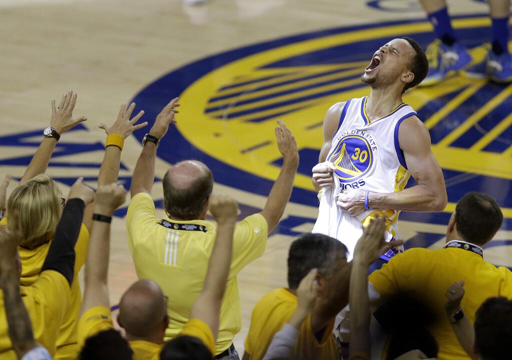 Stephen Curry shouts after the Golden State Warriors beat the Oklahoma City Thunder to advance to the NBA finals. (BEN MARGOT / Associated Press)
