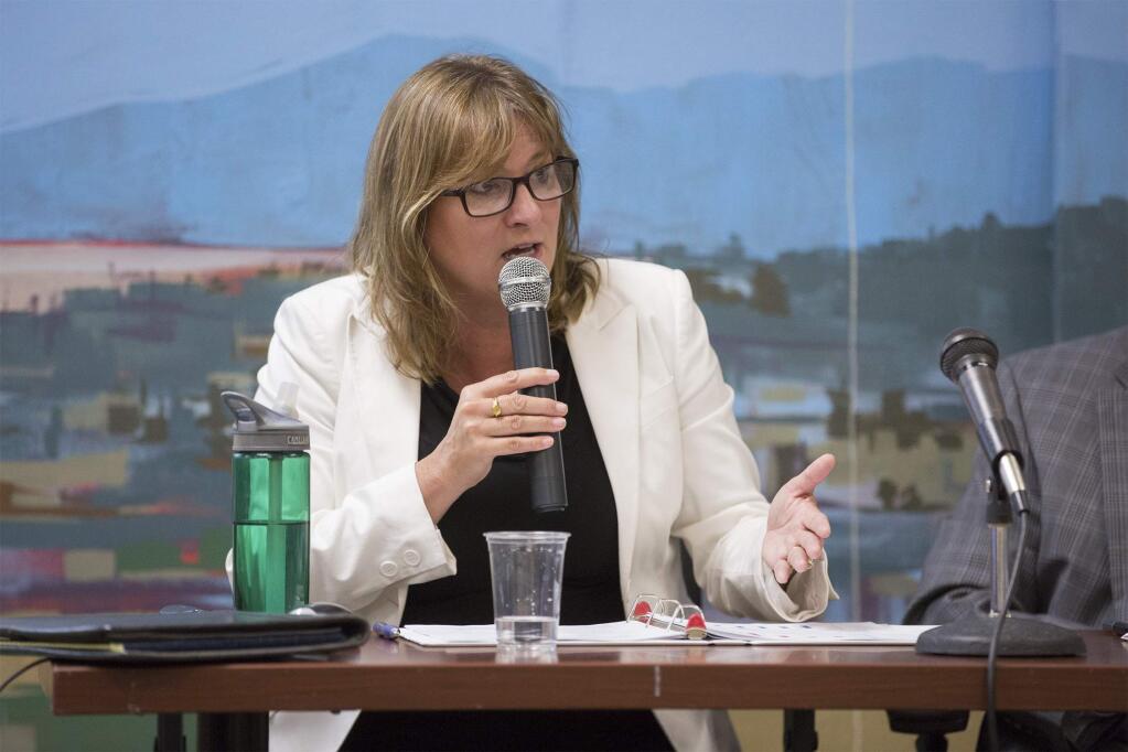 Kelly Mather, CEO of Sonoma Valley Hospital explaining why the obstetrics unit would need to close at the end of October. The Sonoma Valley Hospital Board meeting took place on Wednesday, July 25.(Photo by Robbi Pengelly/Index-Tribune)