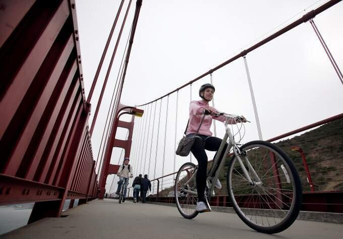 Bicyclists ride north over the Golden Gate Bridge in 2010. (CRISTA JEREMIASON/ PD FILE)