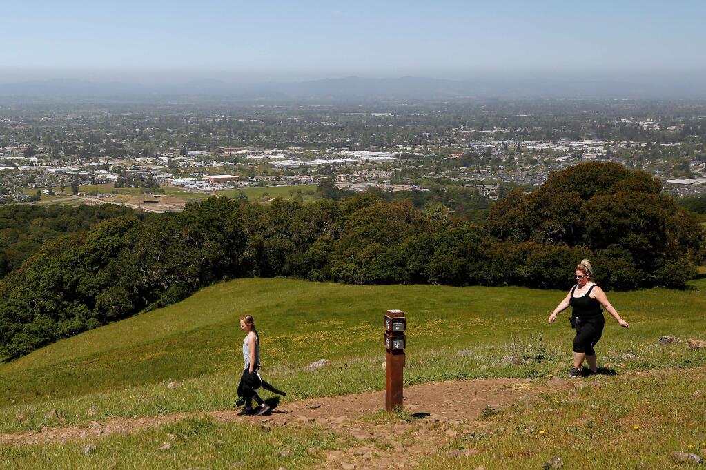 Gianna McLean, 11, takes a birthday hike with her mother Christie McLean on the Sky Lupine Trail at Taylor Mountain Regional Park in Santa Rosa, California, on Thursday, April 25, 2019. (Alvin Jornada / The Press Democrat)