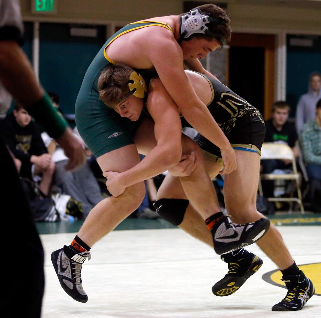 Windsor's Anthony Spallino, right, lifts Casa Grande's Nick Jensen off his feet in their 195-lbs. bout during a varsity wrestling match on Thursday, Jan. 14, 2016. (Alvin Jornada / The Press Democrat)