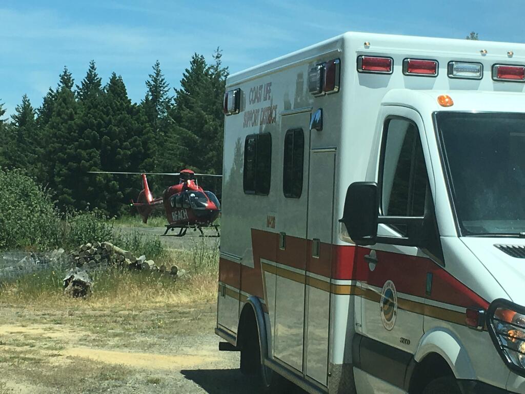 A REACH medical helicopter prepares to fly an injured motorcycle rider to Santa Rosa Memorial Hospital after the biker crashed off Highway 1 on the Sonoma Coast, on May 30, 2016. (Photo courtesy of the Timber Cove Fire Protection District)