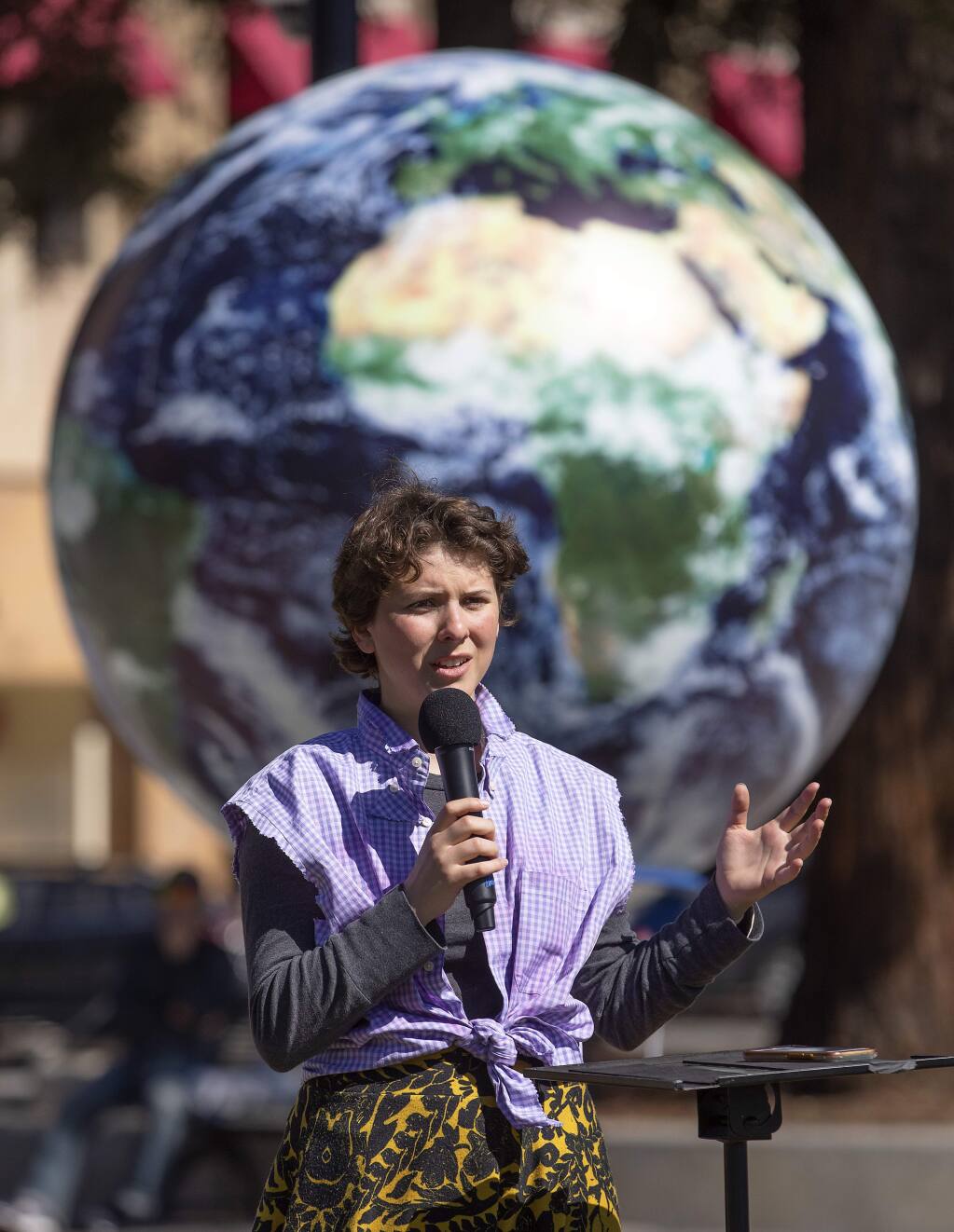 Student leader Lucy London, 17, a senior at the Marin School of the Arts, speaks to a crowd in Courthouse square to demand action against climate change during a rally in Santa Rosa on Friday. The rally was a coordinated event with students around the U.S. and the world. (photo by John Burgess/The Press Democrat)