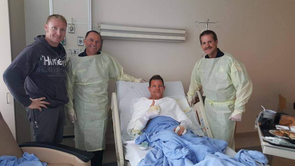 Credit: Cal FireCal Fire firefighter Richard Reiff, center, was in good spirits Monday despire suffering burns while combatting the Valley fire.